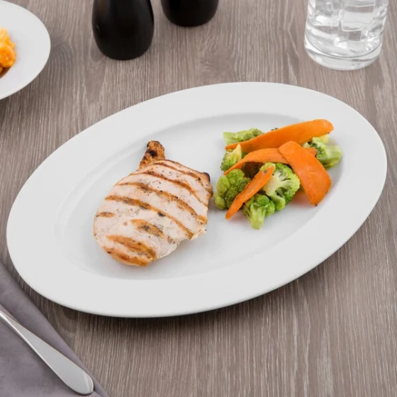 Schonwald 9132033 Fine Dining 12 7/8" x 9" Oval Continental White Porcelain Platter - 6/Case