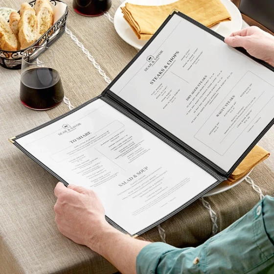 H. Risch, Inc. TED Deluxe Sewn 8 1/2" x 14" Black 4 View Menu Cover with Gold Decorative Corners and Gloss Finish