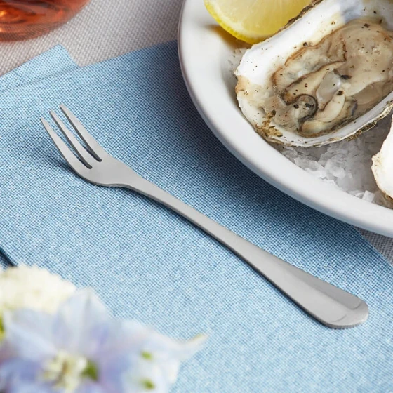 Choice Midland 5 1/2" 18/0 Stainless Steel Medium Weight Cocktail / Oyster Fork - 12/Case