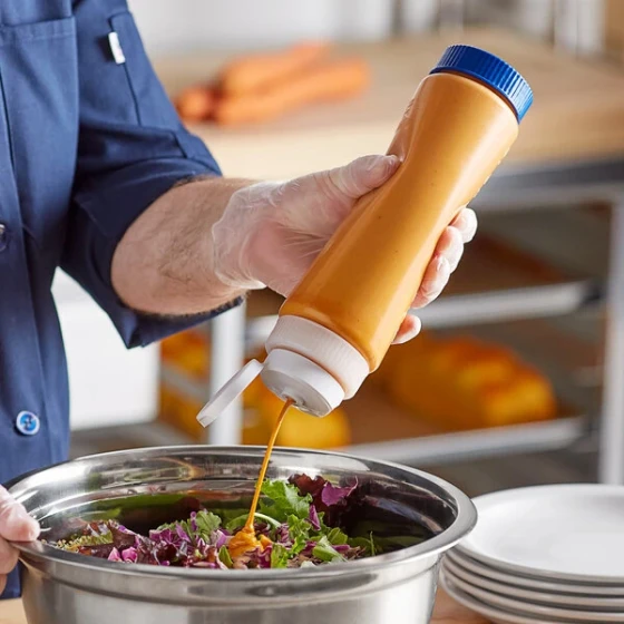 Vollrath Traex® 24 oz. Clear FIFO Squeeze Dispenser with White Flowcut™ Cap and Blue Base Cap