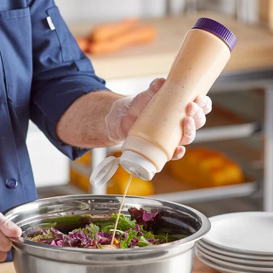 Vollrath Traex® 24 oz. Clear FIFO Squeeze Dispenser with White Flowcut™ Cap and Purple Base Cap