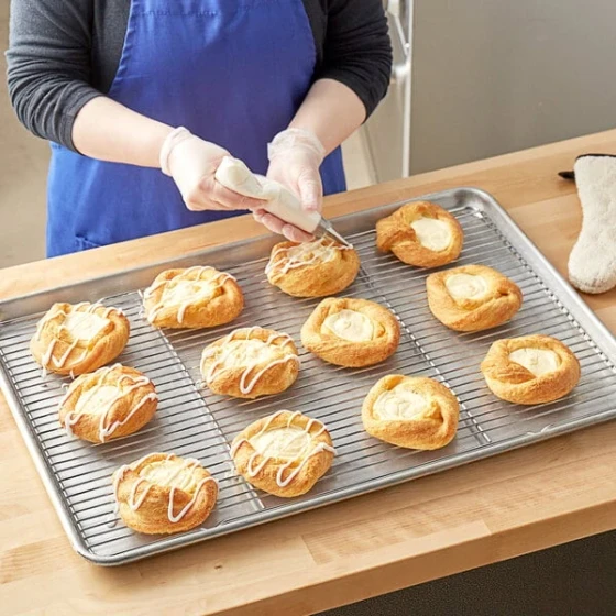 Choice 16 7/16" x 24 1/2" Chrome Plated Footed Wire Icing Rack / Cooling Rack for Full Size Sheet Pan