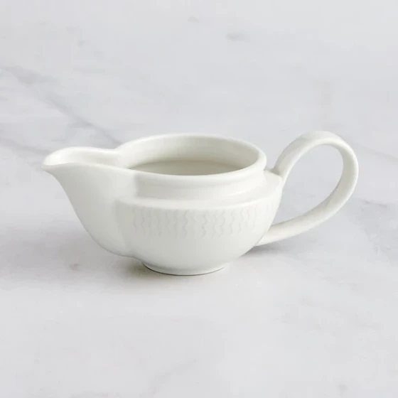RAK Porcelain Leon 5.1 oz. Ivory Embossed Porcelain Gravy Boat - 6/Case