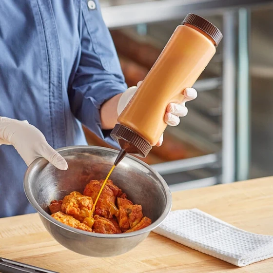 Vollrath Traex® 24 oz. Clear FIFO Squeeze Dispenser with Brown Single Tip Cap and Base Cap