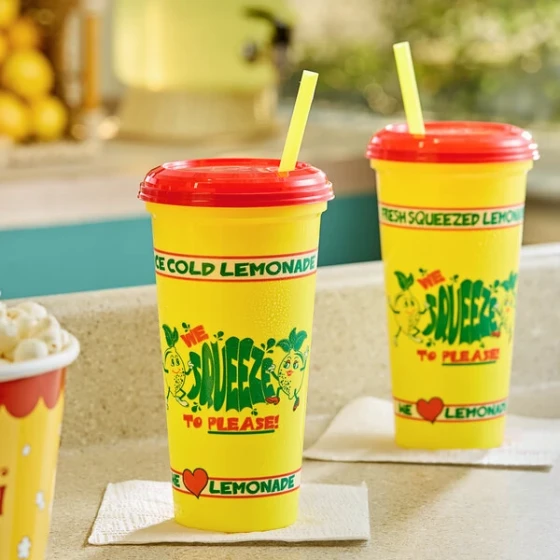 32 oz. "We Squeeze to Please" Tall Plastic Souvenir Cup with Straw and Lid - 200/Case