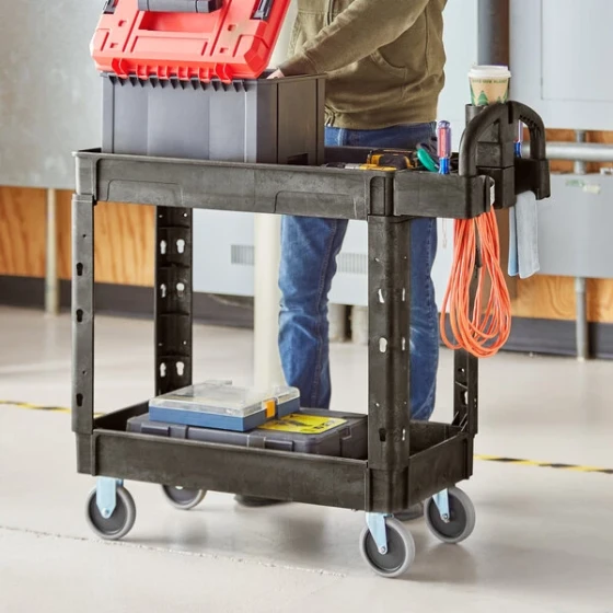 Lavex Medium Black 2-Shelf Utility Cart with Ergonomic Handle and Built-In Tool Compartments - 37 5/8" x 17 1/8" x 38 7/8"