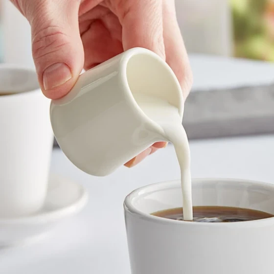 Tuxton BER-015 1.5 oz. Eggshell China Creamer - 48/Case