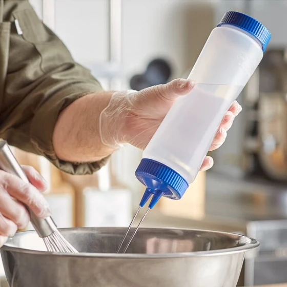 Vollrath Traex® 24 oz. Clear FIFO Squeeze Dispenser with Blue Twin Tip™ Cap and Base Cap