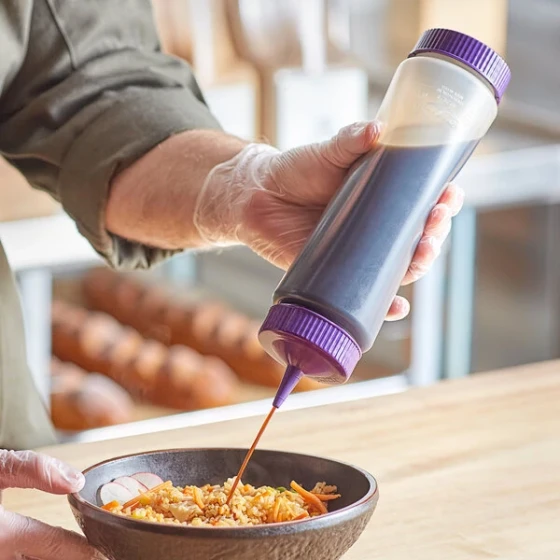 Vollrath Traex® 24 oz. Clear FIFO Squeeze Dispenser with Purple Single Tip Cap and Base Cap