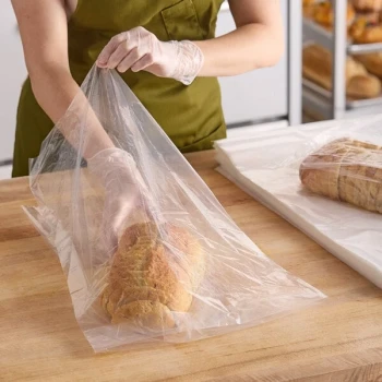 Choice 14" x 4" x 20" 1.25 Mil Clear Gusseted LDPE Bread Bag on Wicket Dispenser - 1,000/Case