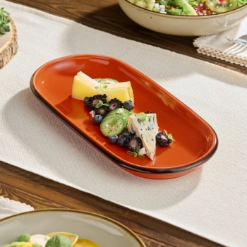 Acopa Keystone 12 1/2" x 6" Sedona Orange Porcelain Oblong Coupe Platter - Sample