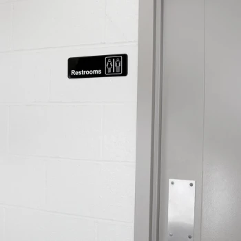 Vollrath 4517 Traex® Restrooms Sign - Black and White, 9" x 3"
