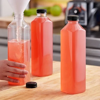 Captiva Containers 32 oz. Tall Square PET Clear Juice Bottle with Black Lid - 104/Case