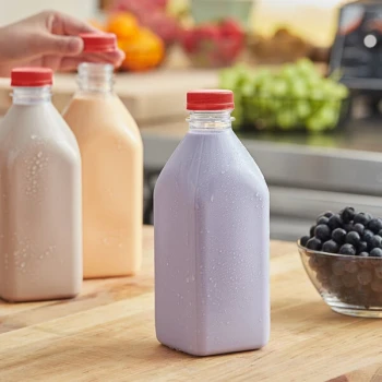 Captiva Containers 32 oz. Square Milkman PET Clear Juice Bottle with Red Lid - 77/Case