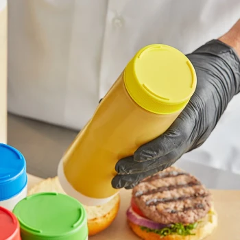 TableCraft 63FCAPY Solid Yellow End Cap for Inverted or Squeeze Bottles with a 63 mm Opening - 12/Pack