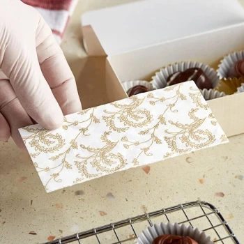 Simplex 5 3/8" x 2 5/8" 3-Ply Glassine 1/2 lb. White Candy Box Pad with Gold Floral Pattern - 250/Case