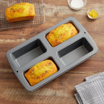 Wilton 191003131 Recipe Right Steel 4-Compartment Non-Stick Mini Loaf Pan - 5 3/4" x 3" x 2 1/8" Cavities