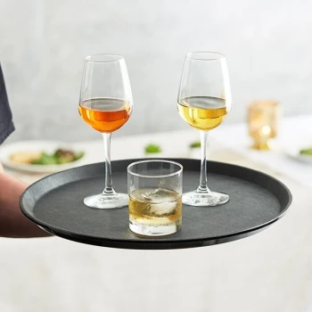 Choice 16" Black Round Polypropylene Non-Skid Serving Tray - 12/Case