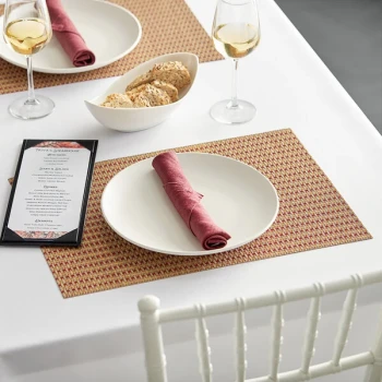 RITZ® 64905 19" x 13" Tan / Orange / Rust Open Basketweave PVC Coated Placemat - 12/Pack