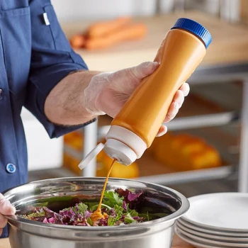 Vollrath Traex® 24 oz. Clear FIFO Squeeze Dispenser with White Flowcut™ Cap and Blue Base Cap