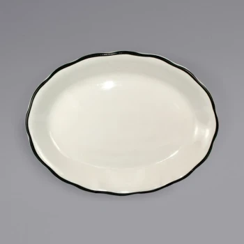 International Tableware Sydney 9 7/8" x 7 1/4" Ivory (American White) Scalloped Edge Stoneware Platter with Black Rim - 24/Case