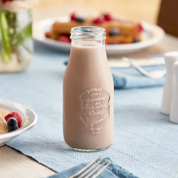 Acopa 10 oz. Embossed Glass Milk Bottle - 12/Case