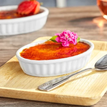 Acopa 5 oz. Oval Bright White Fluted Porcelain Souffle / Creme Brulee Dish - 36/Case