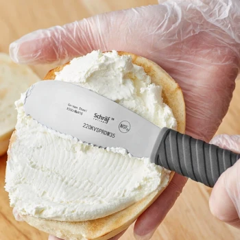 Schraf 3 1/2" Scalloped Stainless Steel Sandwich Spreader with TPRgrip Handle