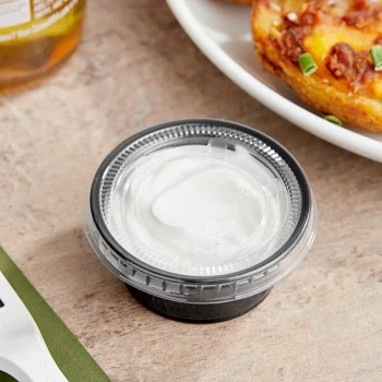 Choice 2 oz. Black Plastic Souffle Cup / Portion Cup with PET Plastic Lid - 100/Case