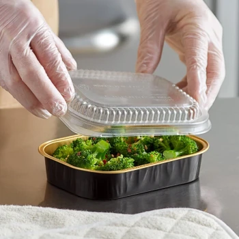 Choice Heavy Duty Smoothwall Black and Gold Mini Oblong Foil Take-Out Pan with Dome Lid 16 oz. - 25/Pack