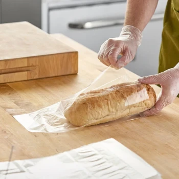 Choice 9" x 4" x 13" 1 Mil Clear Gusseted Polypropylene Bread Bag on Wicket Dispenser - 1,000/Case