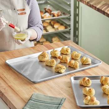 Nordic Ware Naturals 12 7/8 inch x 17 7/8 inch Half Size 20 Gauge Wire in Rim Aluminum Bun / Sheet Pan 43100
