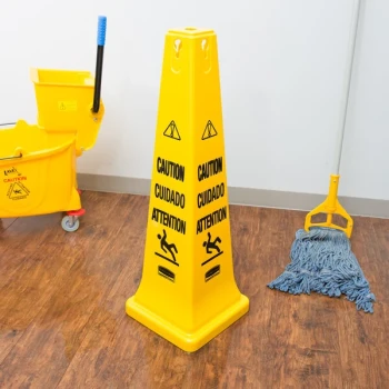 Rubbermaid® FG627600YEL 36" Yellow Multi-Lingual Wet Floor Cone-Shaped Sign - "Caution"