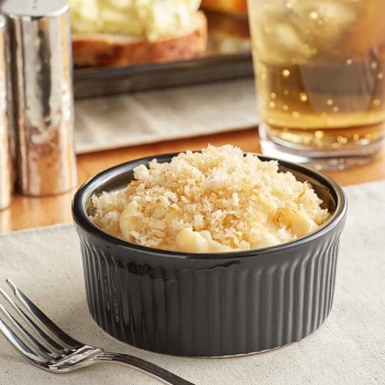 Acopa 10 oz. Round Glossy Black Fluted Stoneware Souffle / Creme Brulee Dish - 24/Case