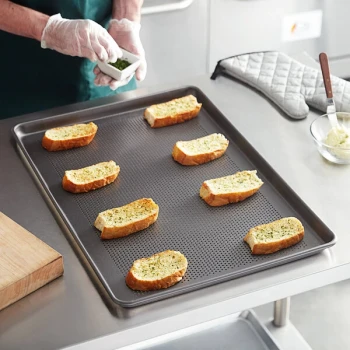 Vollrath 9002NSP Wear-Ever Full Size 18 Gauge Non-Stick 18 inch x 26 inch Wire in Rim Perforated Aluminum Bun / Sheet Pan