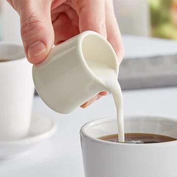 Tuxton BER-015 1.5 oz. Eggshell China Creamer - 48/Case