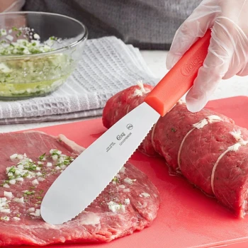 Choice 5 1/2" Scalloped Stainless Steel Sandwich Spreader with Red Polypropylene Handle