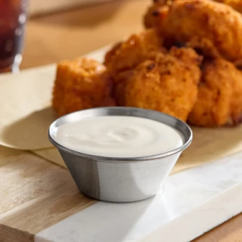 Choice 1.5 oz. Smooth Stainless Steel Round Sauce Cup - 12/Pack