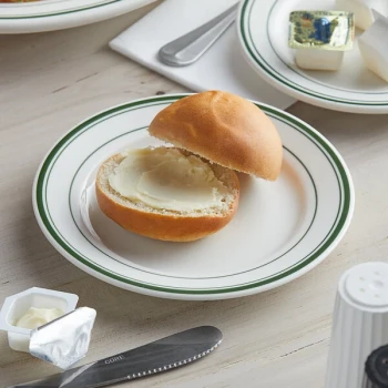 Tuxton TGB-031 Green Bay 6 1/4" Eggshell Wide Rim Rolled Edge China Plate with Green Bands - 36/Case