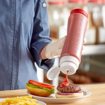 Vollrath Traex® 24 oz. Clear FIFO Squeeze Dispenser with White Flowcut™ Cap and Red Base Cap