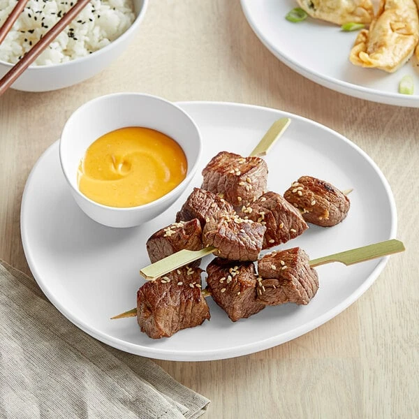 GET Riverstone 9 1/8" White Irregular Round Matte Melamine Coupe Plate - Sample