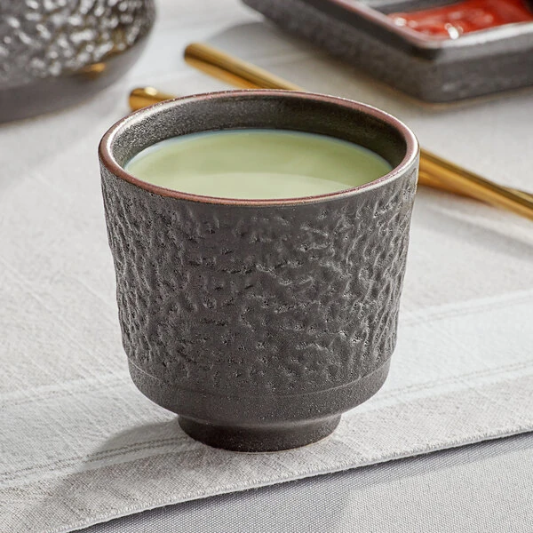 Acopa Heika 5 oz. Black Matte Textured Stoneware Tea Cup - Sample