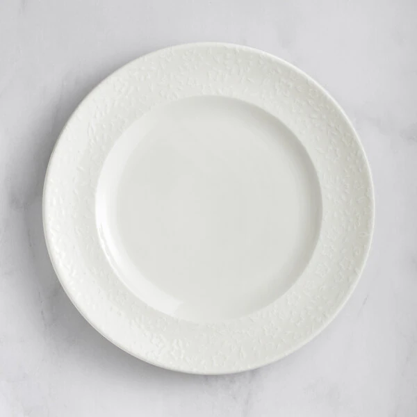 RAK Porcelain Blossom 11" Ivory Embossed Wide Rim Porcelain Flat Plate - 12/Case