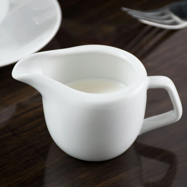 Tuxton GZP-100 TuxTrendz 3 oz. Porcelain White China Creamer - 12/Case