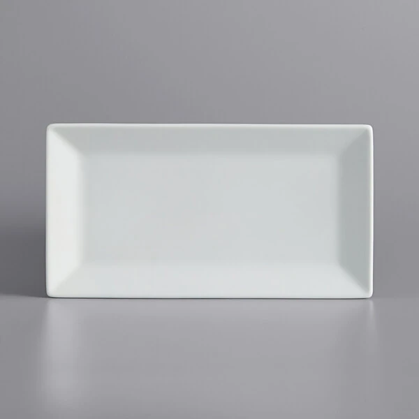 International Tableware Slope 10" x 5 1/4" Rectangular Bright White Wide Rim Porcelain Platter - 12/Case