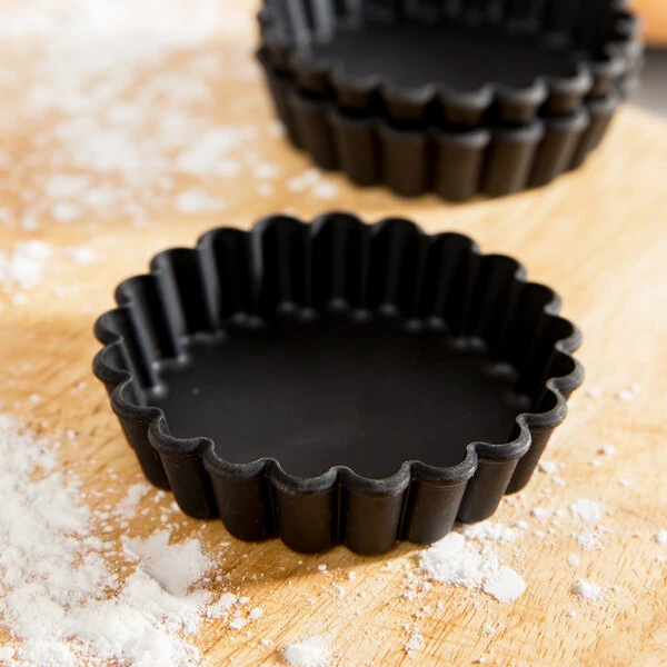 Matfer Bourgeat 345659 Exoglass 4 5/16" x 3/4" Fluted Non-Stick Tartlet / Quiche Mold - 12/Pack