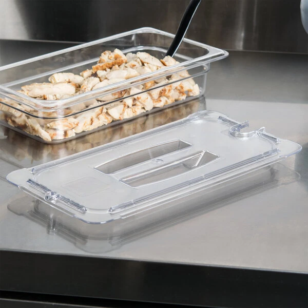 Carlisle 10271U07 StorPlus 1/3 Size Clear Universal Handled Lid with Spoon Notch
