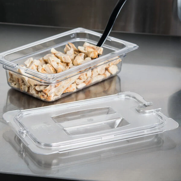 Carlisle 10291U07 StorPlus 1/4 Size Clear Universal Handled Lid with Spoon Notch