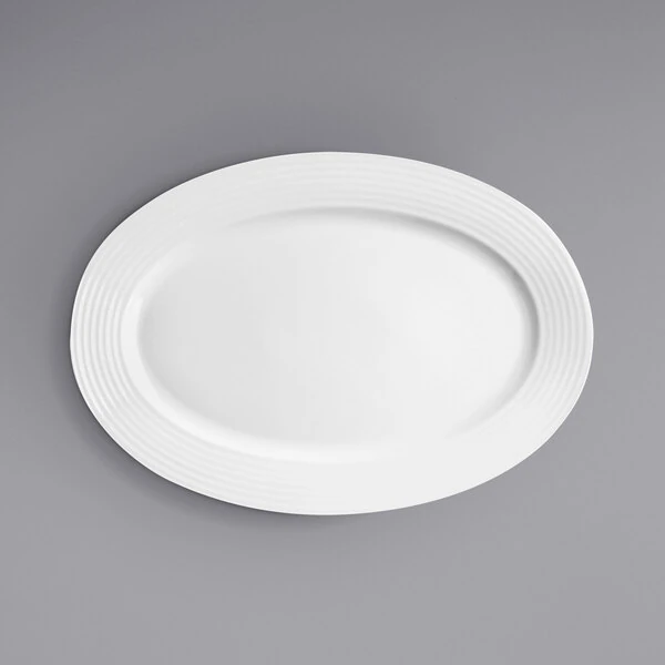 RAK Porcelain Rondo 12 5/8" x 8 5/8" Ivory Embossed Wide Rim Porcelain Oval Plate - 6/Case