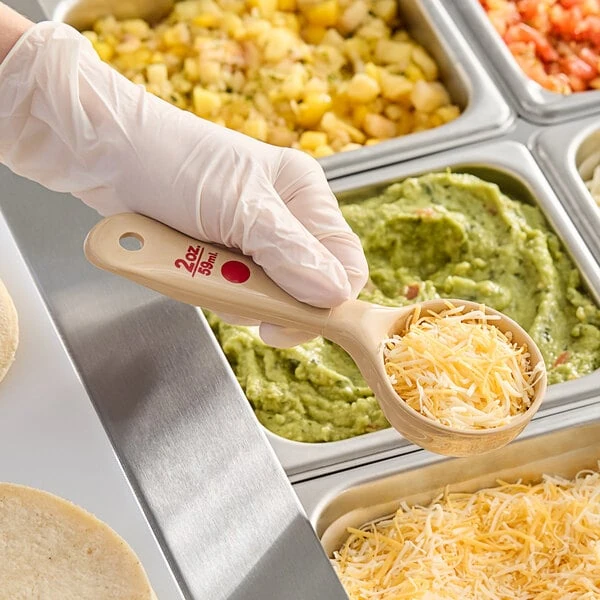 Carlisle 432406 Measure Misers 2 oz. Beige and Red Color Coding Polycarbonate Short Handle Solid Portion Spoon
